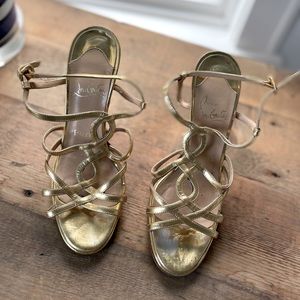 Gold Louboutin high heels